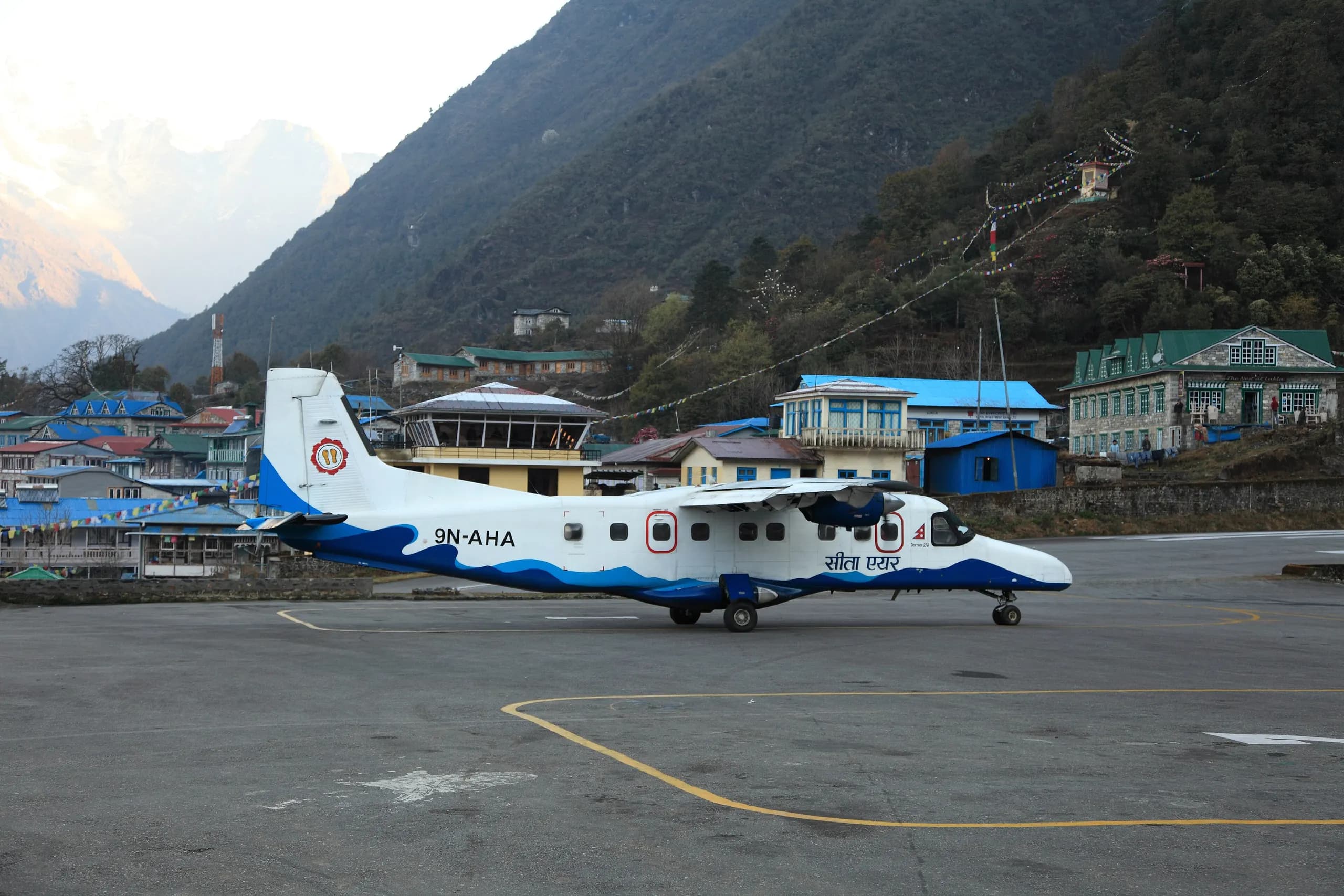 A Dornier 228 aircraft on the sloped runway of Tenzing-Hillary Airport, Lukla